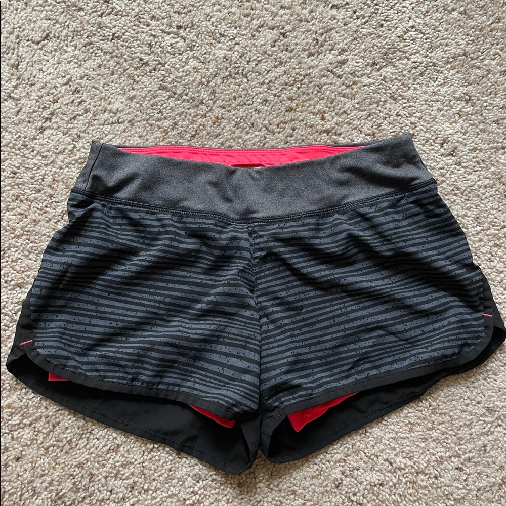 Women’s black running shorts with neon lining. Size Small